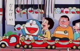 Immagine di Doraemon e nobita sul trenino con i loro amici